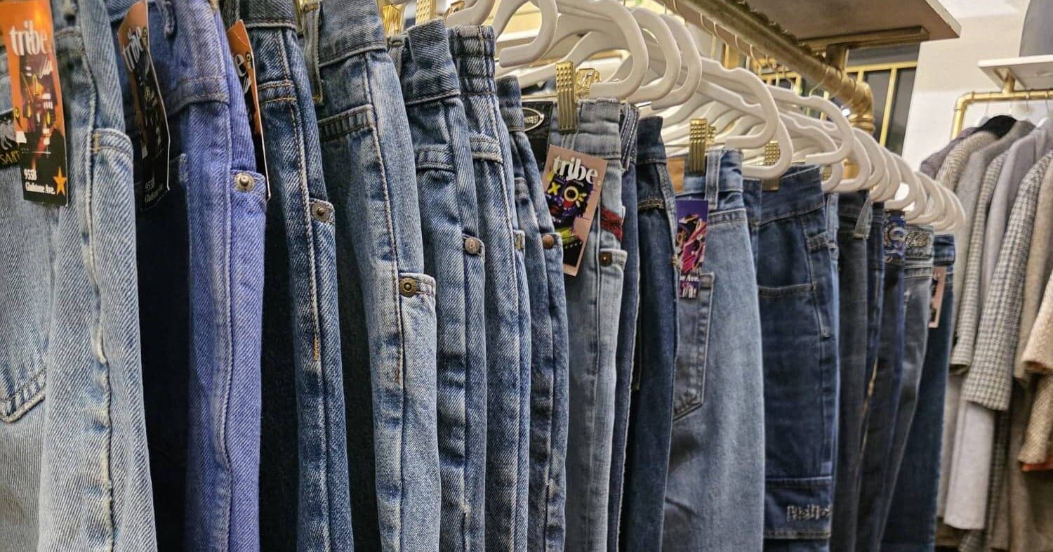 Vintage jeans with TRiBE tags on a rack